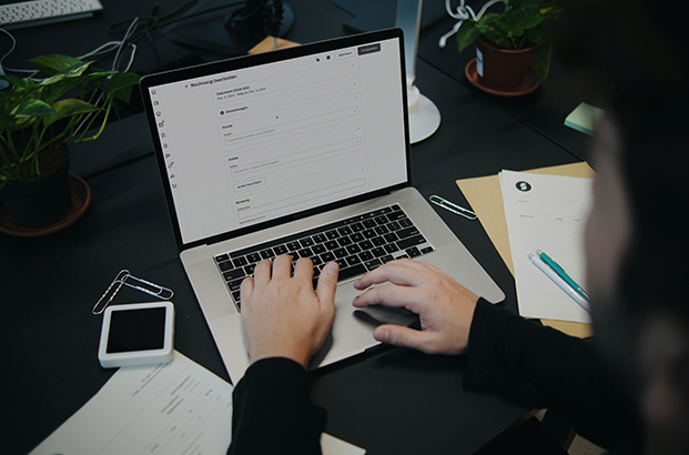 Professional workspace with laptop and documents